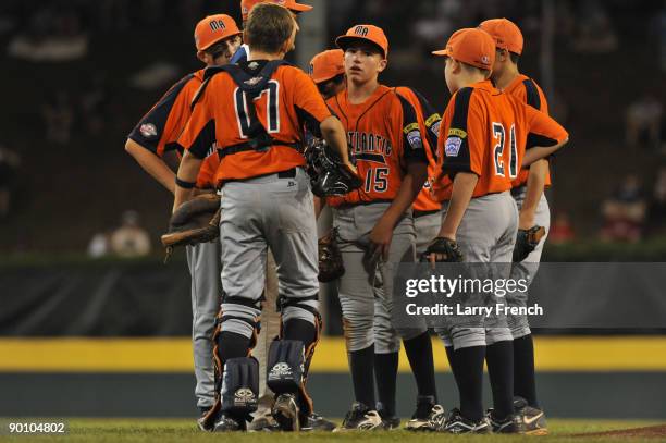 Starting pitcher Angelo Navetta of Staten Island, NY talks with his teammates before being replaced during the game against San Antonio, Texas in the...