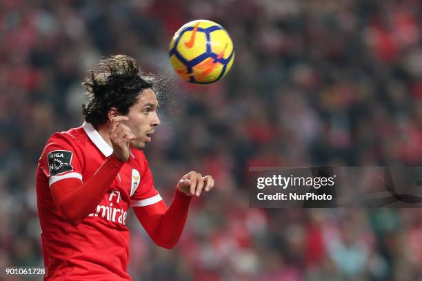 Benfica's Croatian forward Filip Krovinovic heads the ball during the Portuguese League football match SL Benfica vs Sporting CP at the Luz stadium...