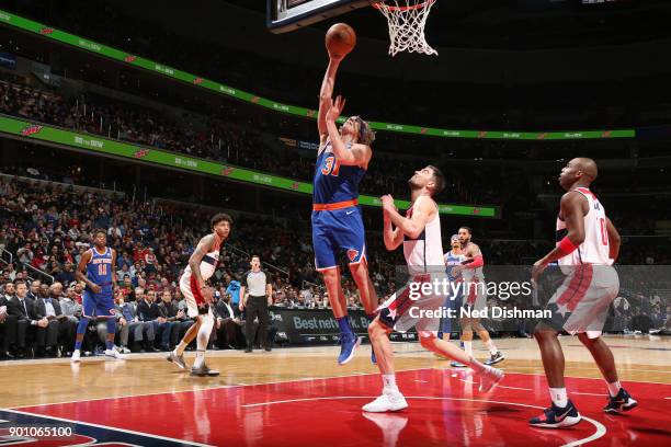 Ron Baker of the New York Knicks handles the ball against the Washington Wizards on January 3, 2018 at Capital One Arena in Washington, DC. NOTE TO...