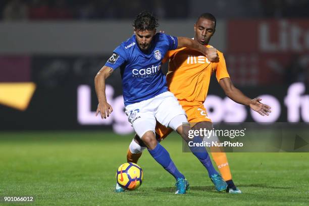 Porto's Portuguese midfielder Danilo Pereira vies with Feirense's Portuguese forward Hugo Seco during the Premier League 2016/17 match between CD...