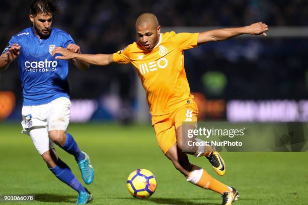 Porto's Algerian forward Yacine Brahimi in action with Feirense's Portuguese forward Hugo Seco during the Premier League 2016/17 match between CD...