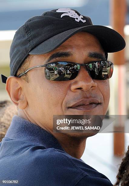 President Barack Obama waits to pick up lunch at Nancy's fast food restaurant in Oak Bluffs on Martha's Vineyard, Massachusetts, on August 26, 2009....