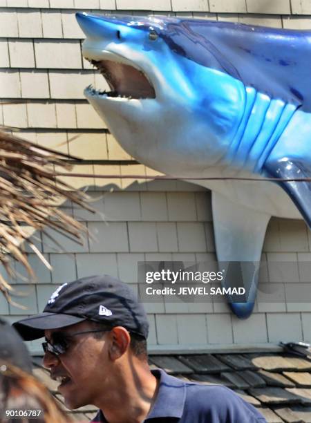 President Barack Obama waits to pick up lunch at Nancy's fast food restaurant in Oak Bluffs on Martha's Vineyard, Massachusetts, on August 26, 2009....