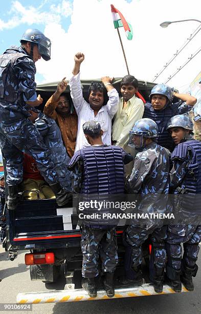 Nepalese police detain supporters of Vice President Parmananda Jha protesting the Supreme Court's order for him to retake the oath of secrecy and...