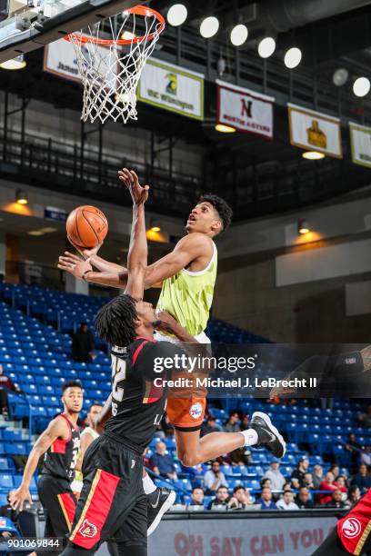 Devin Robinson of the Delaware 87ers handles the ball against the Erie Bayhawks during an NBA G-League game on January 3, 2018 at Bob Carpenter...