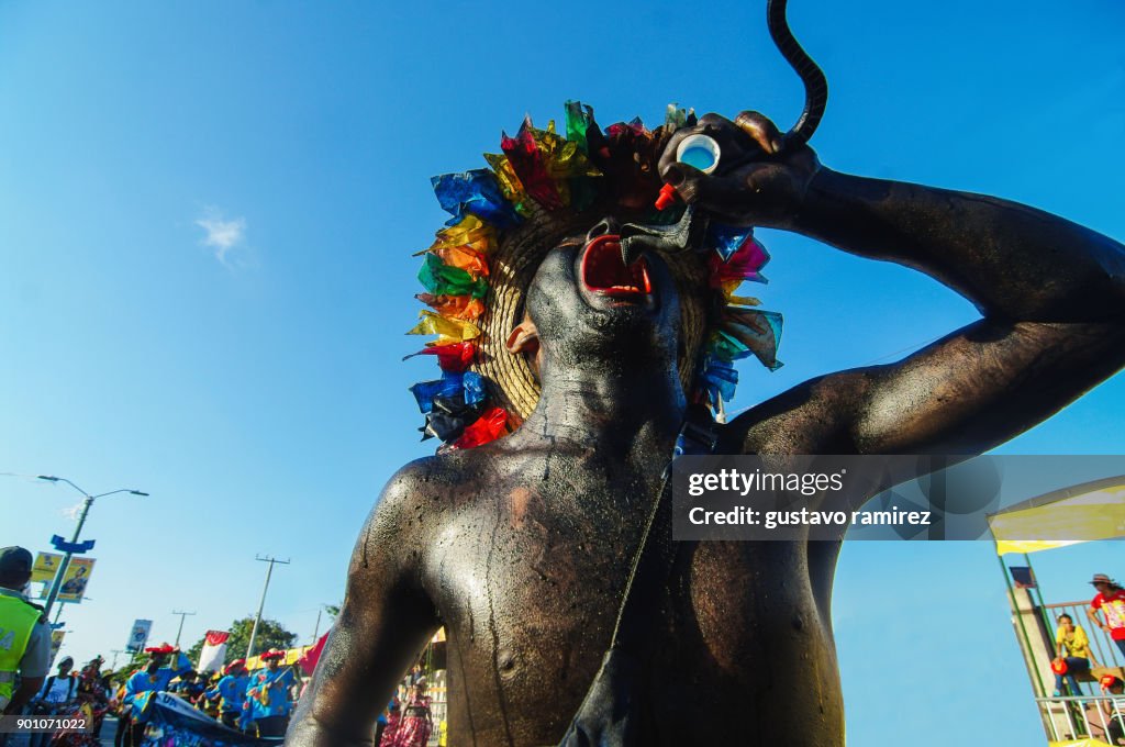 Parade of traditional carnival dancers in barranquilla