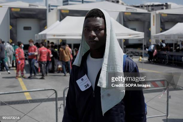 African refugees seen leaving from the ship after being rescued. About 1500 african refugees land in Naples from Vos Prudence, a rescue boat of...