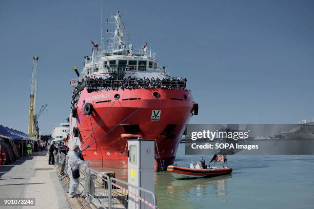 African refugees seen waiting to leave from the ship after being rescued. About 1500 african refugees land in Naples from Vos Prudence, a rescue boat...