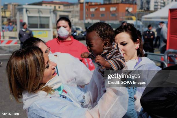 Doctor seen saving a child from a respiratory crisis during landing operations from Vos Prudence, a rescue boat of Msf. On May 28th 2017, "Vos...