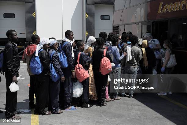 Rescued refugees wait to be moved by bus in different places in the whole Campania region. About 1500 african refugees land in Naples from Vos...