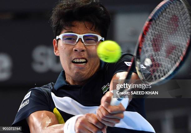 Chung Hyeon of South Korea hits a return against Kyle Edmund of Britain during their men's singles second round match at the Brisbane International...