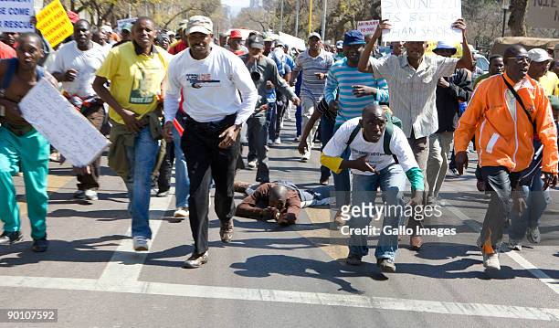 South African Police participate in an illegal march at the Union Buildings August 26, 2009 in Pretoria, South Africa. The Pretoria High Court...