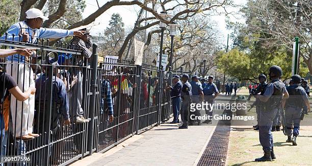 South African Police keep a watchful eye on protesting soldiers participating in an illegal march at the Union Buildings August 26, 2009 in Pretoria,...