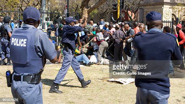 South African Police open fire on protesting soldiers participating in an illegal march at the Union Buildings August 26, 2009 in Pretoria, South...