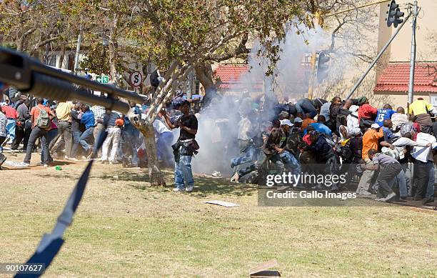 South African Police open fire on protesting soldiers participating in an illegal march at the Union Buildings August 26, 2009 in Pretoria, South...