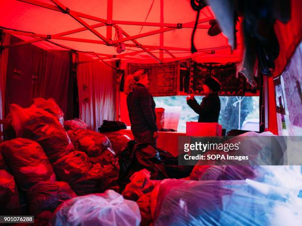 Inside the red tent clothes are piled and ready to be used in case of necessity. Dirty Girls of Lesbos is a volunteer group born in September 2015 by...