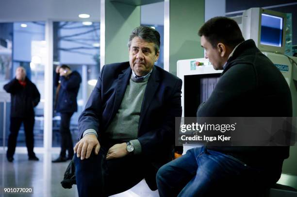 German Foreign Minister Sigmar Gabriel and the Foreign Minister of Ukraine, Pavlo Klimkin, talk at the airport, on January 04, 2018 in Dnipro,...