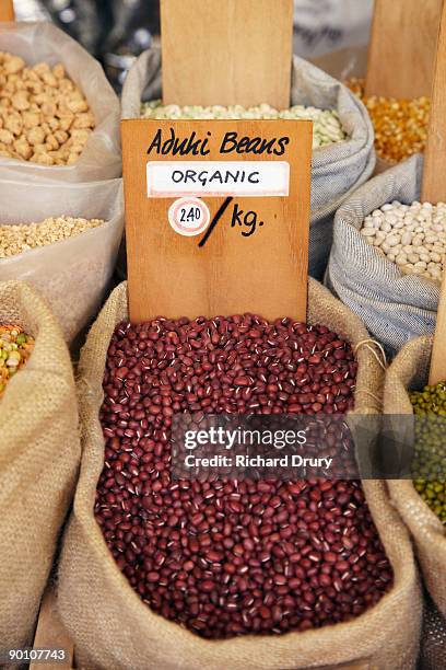 organic aduki beans on market stall - aduki stock pictures, royalty-free photos & images