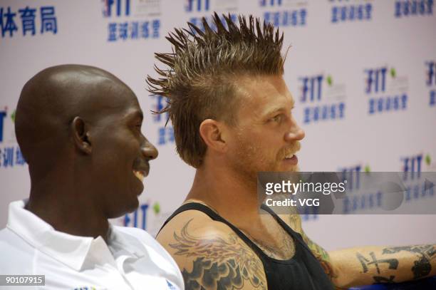 Star Chris Andersen of the Denver Nuggets and former American professional basketball player Bo Outlaw attend a press conference on August 26, 2009...