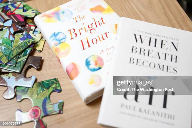 John Duberstein late wife's book is seen with Lucy Kalanithi's late husband's book in Kalanithi's home in San Mateo, Ca. On December 30, 2017.