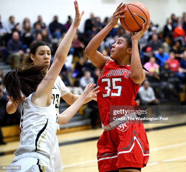 St. John's Cadets Azzi Fudd shoots for two in the first half January 03, 2018 in Fairfax, VA. The St. John's Cadets beat the Paul VI Panthers 51-45.