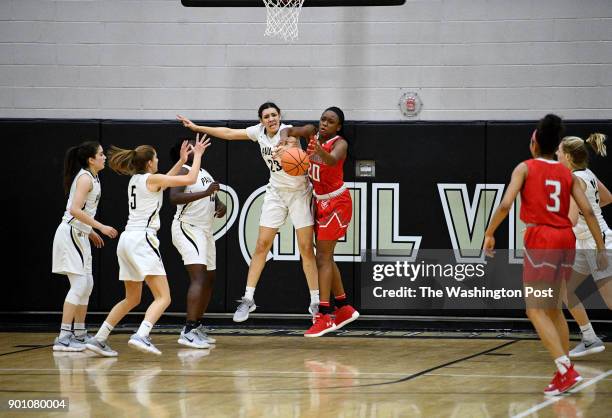 Paul VI Panthers forward Amira Collins and St. John's Cadets center Malu Tshitenge-Mutombo chase down the rebound in the second half January 03, 2018...