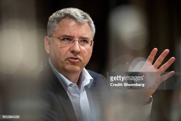 Severin Schwan, chief executive officer Roche Holding AG, gestures as he speaks during an interview in London, U.K., on Wednesday, Dec. 6, 2017....