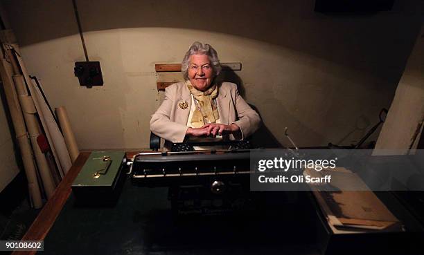 Veteran War Room shorthand typist Myra Collyer sits behind a typewriter in the Cabinet War Rooms bunker where she used to work during the second...