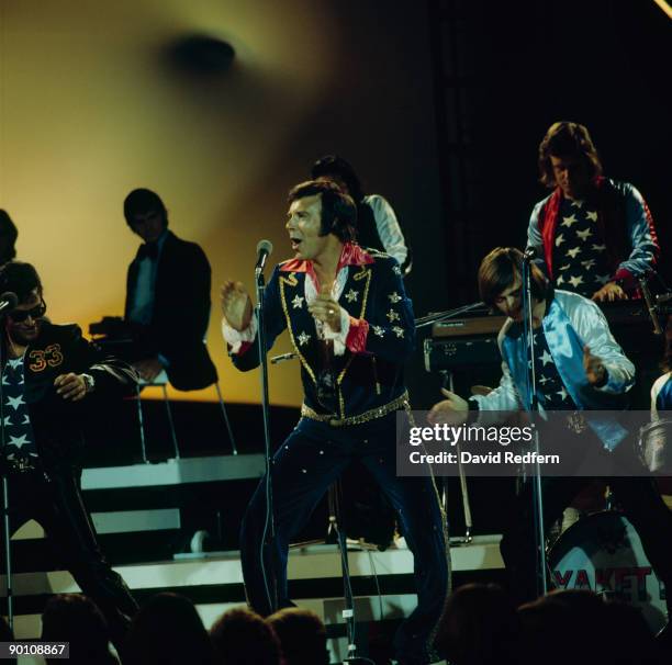 Singer Marty Wilde performs on a tv show circa 1970.