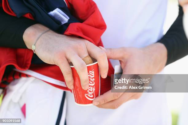 Goalkeeper Sven Ulreich cools his sprained finger after a training session on day 3 of the FC Bayern Muenchen training camp at ASPIRE Academy for...