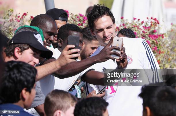 Mats Hummels of Muenchen poses with fans during a training session on day 3 of the FC Bayern Muenchen training camp at ASPIRE Academy for Sports...
