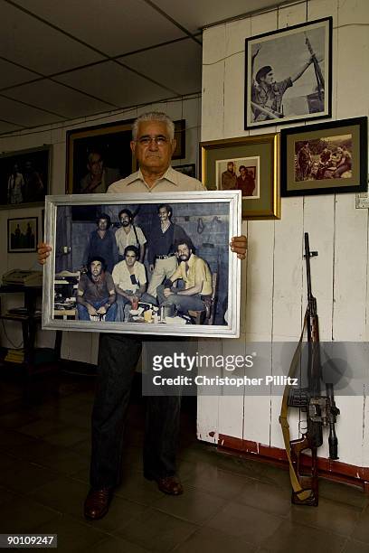 Eden Pastora , also known as "Comandante Cero", seen at home surrounded by photographs and weapons used during his years in combat, including the...