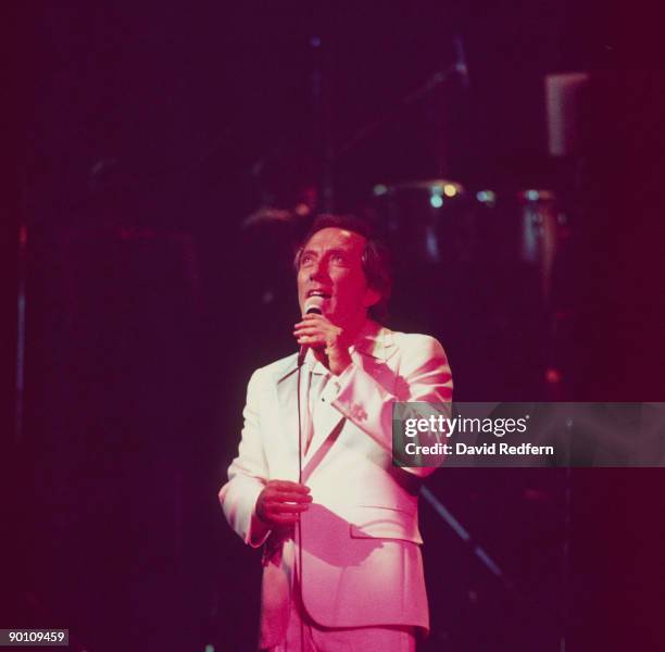 Singer Andy Williams performs on stage at the Palladium in London, England in October 1976.