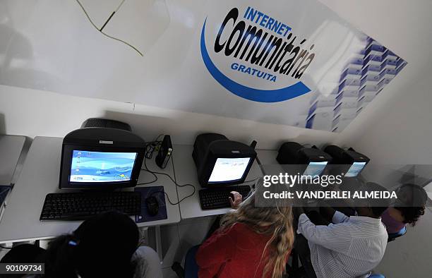 People check internet in Dona Marta shantytown, Rio de Janeiro, Brazil on August 25, 2009. Rio de Janeiro's government set up a plan for the...