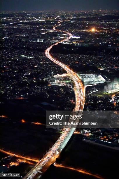 In this aerial image, long queue of cars are seen near the Tomei Expressway Ebina Service Area after people spent their New Year holidays at their...