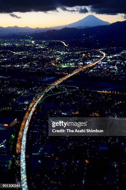 In this aerial image, long queue of cars are seen near the Tomei Expressway Ebina Service Area after people spent their New Year holidays at their...