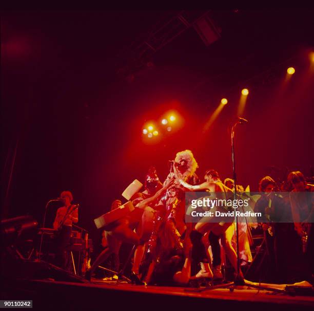 Fee Waybill of The Tubes performs on stage at the Hammersmith Odeon in London, England in 1978.