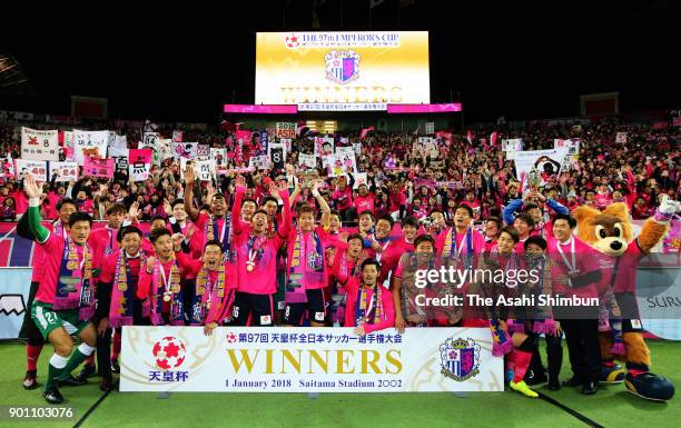 Captain Yoichiro Kakitani of Cerezo Osaka lifts the trophy after the 97th Emperor's Cup All Japan Football Championship final between Cerezo Osaka...