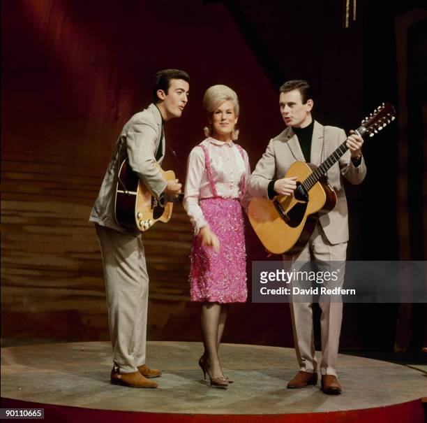 English pop folk group The Springfields, featuring from left, Mike Hurst, Dusty Springfield and Tom Springfield, perform together on a television...