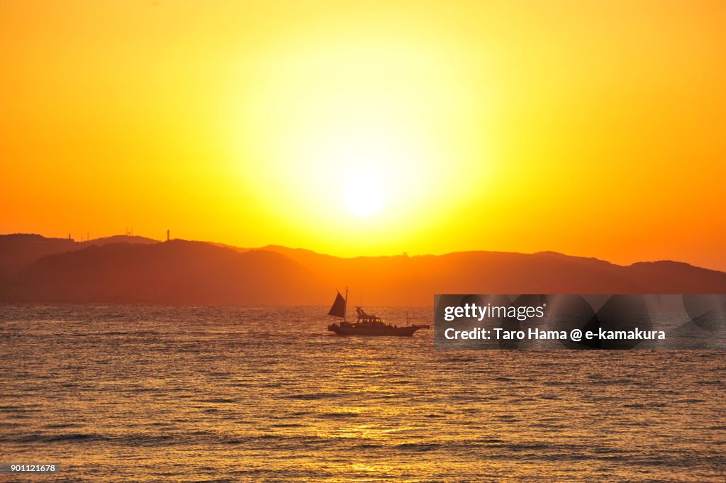 A fisher boat and rising sun on Miura Peninsula and Sagami Bay in Kanagawa prefecture in Japan