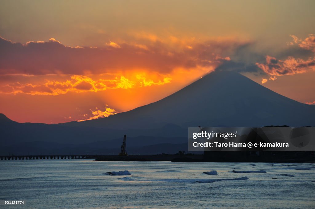 Orange-colored clouds on Mt. Fuji in Japan, after sunset