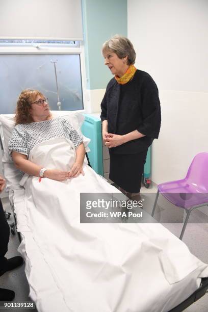 Prime Minister Theresa May meets patient Sandra Dunn at Frimley Park Hospital on January 4, 2018 in Frimley, England.