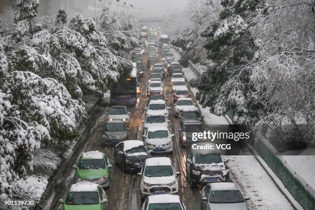 Vehicles move in the heavy snow on January 4, 2018 in Hefei, Anhui Province of China. Blizzard hit Anhui since Wednesday night, and the snow in more...