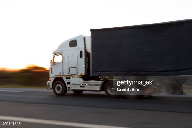 semi truck with trailer on the road - highway side view stock pictures, royalty-free photos & images