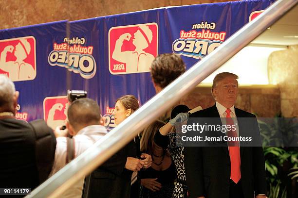 Business man and media personality Donald Trump waits in the wings during a press conference where he planned to announce the intent to purchase the...