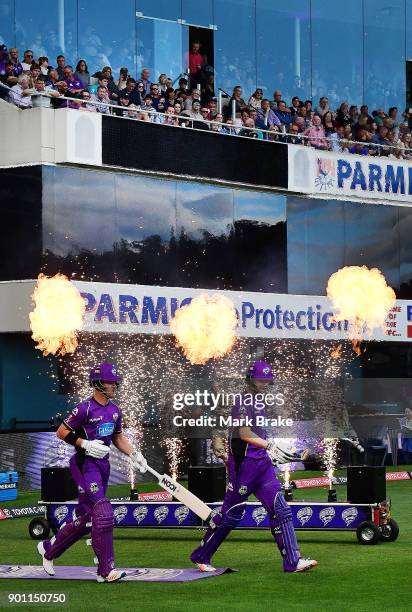 Hobart Hurricanes opening batsman head out during the Big Bash League match between the Hobart Hurricanes and the Adelaide Strikers at Blundstone...