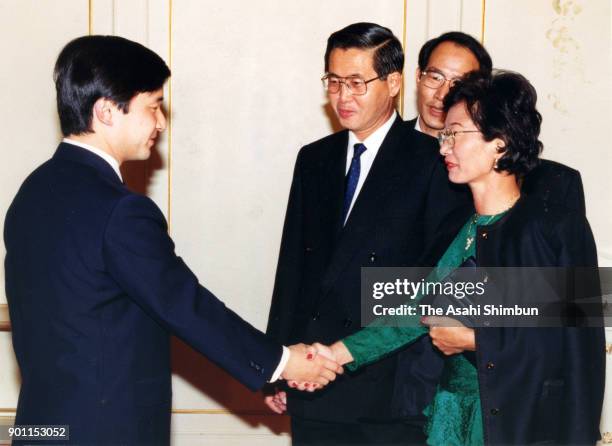 Crown Prince Naruhito shakes hands with Peruvian President Alberto Fujimori and his wife Susana Higuchi prior to attend the Inter-American...