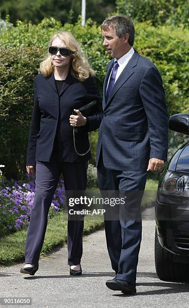 Joan Kennedy, former wife of the late Sen. Edward M. Kennedy, is escorted to a waiting car at the Kennedy compound in Hyannis Port, Massachusetts on...