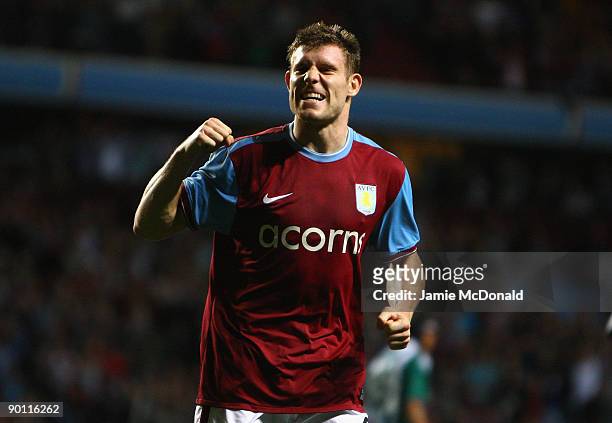 James Milner of Aston Villa celebrates scoring the opening goal from the penalty spot during the UEFA Europa League Play off second leg match between...