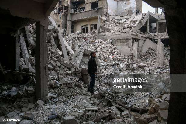 Wreckages of collapsed buildings are seen after Assad Regime's airplanes carried out airstrike over the besieged town of Arbin in Eastern Ghouta in...